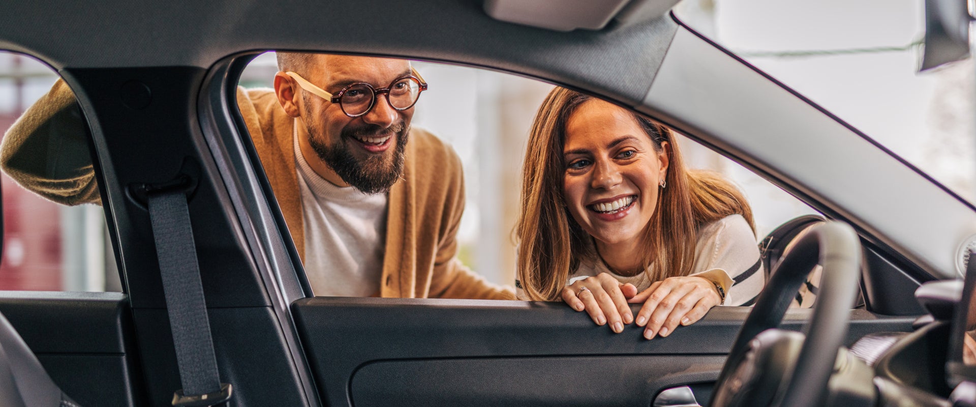 Couple looking at a new vehicle